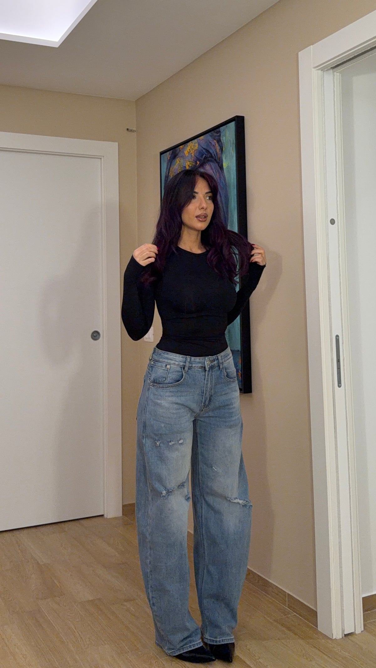 Jeans chiaro con strappi